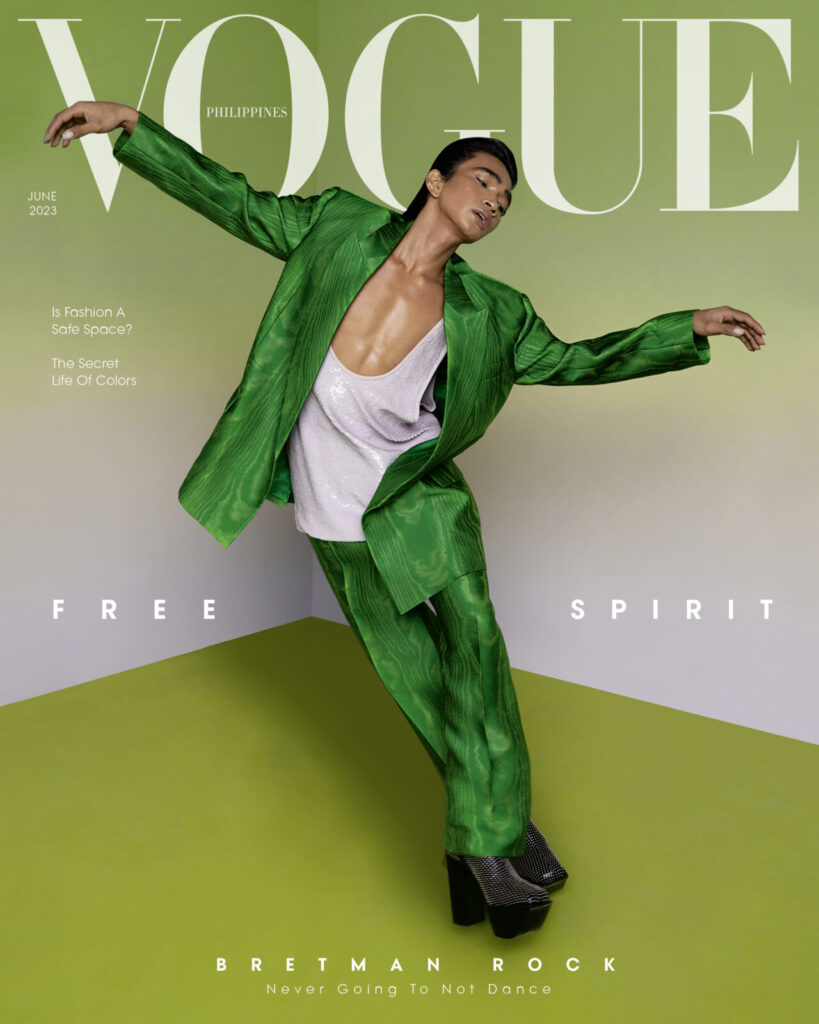 Vogue Philippines cover with Bretman Rock featured as the model. A green background and fluid movement is depicted.